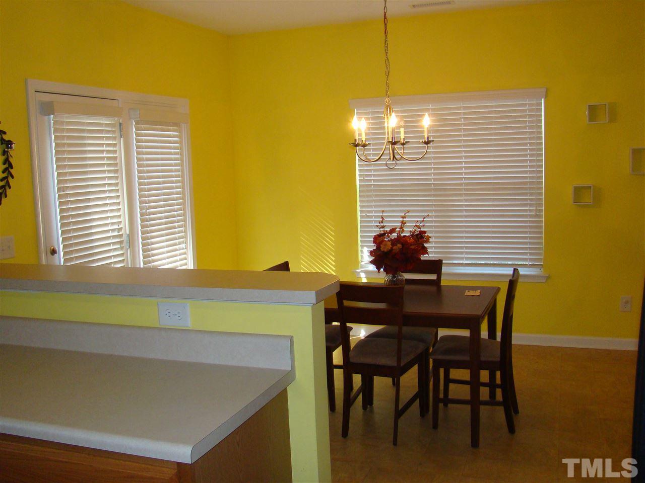 3102 Binghampton Lane Raleigh, NC 27604 - Photo 6 of 13 a view of a dining room with furniture and chandelier