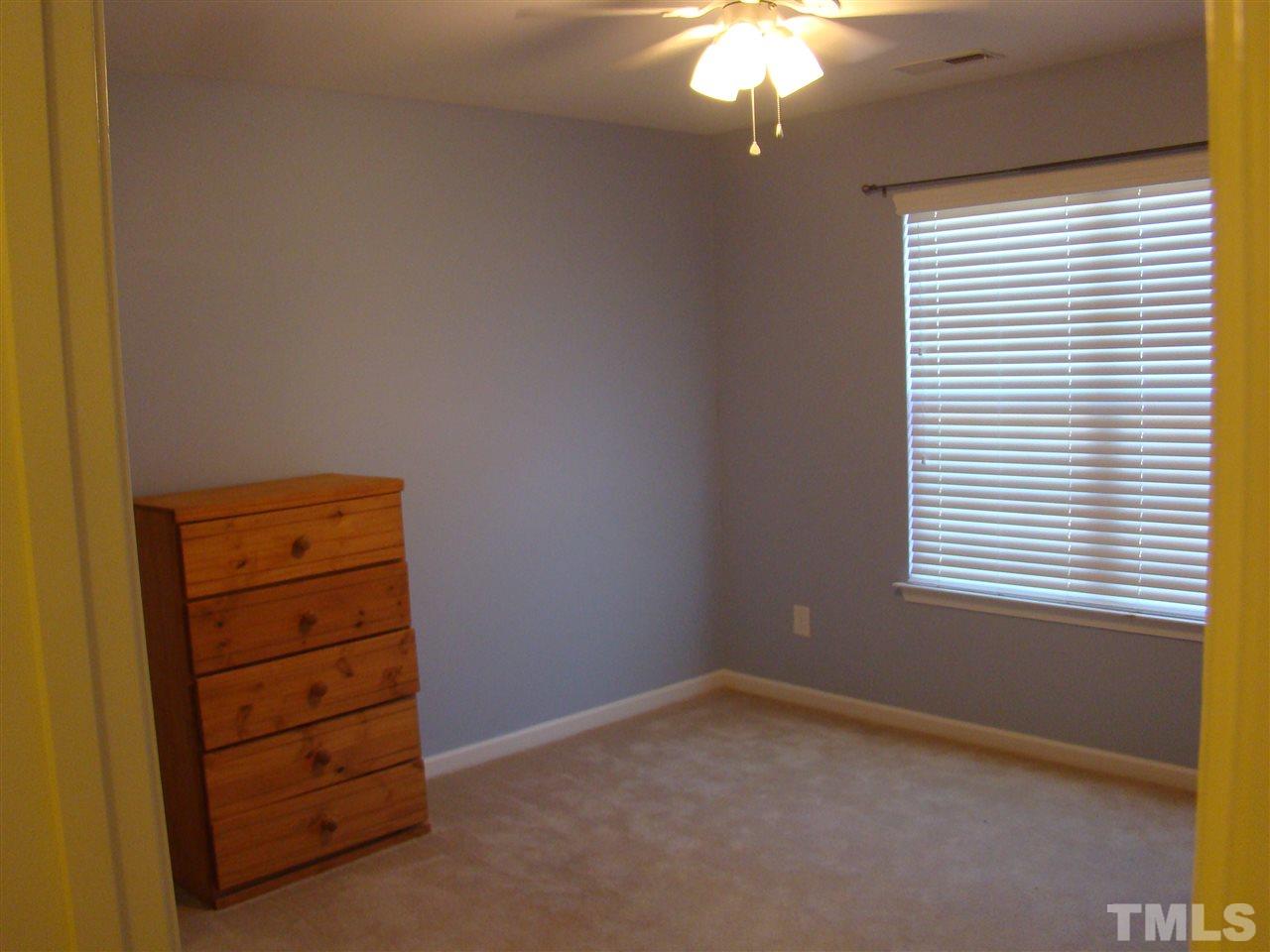3102 Binghampton Lane Raleigh, NC 27604 - Photo 8 of 13 an empty room with a window