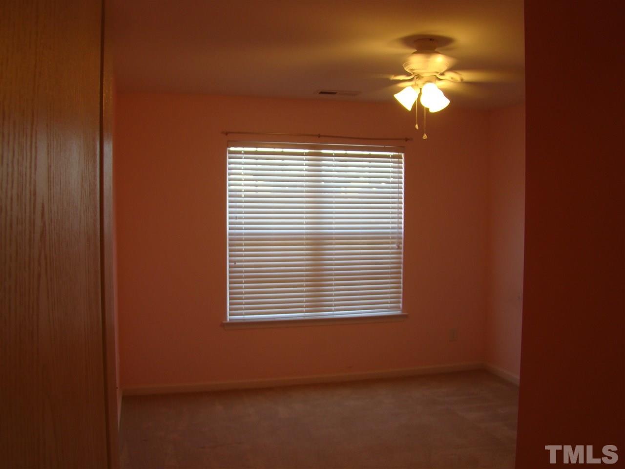 3102 Binghampton Lane Raleigh, NC 27604 - Photo 9 of 13 a view of an empty room with a window
