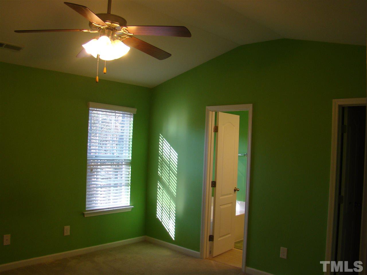 3102 Binghampton Lane Raleigh, NC 27604 - Photo 10 of 13 a view of a livingroom with a window and a ceiling fan