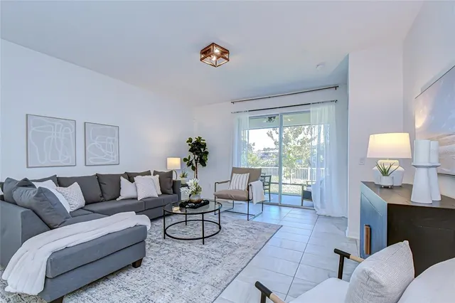 a living room with furniture and a large window