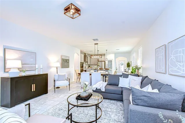 a living room with furniture and a table