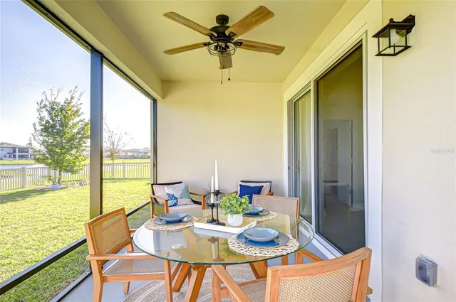 a view of a house with backyard porch and sitting area