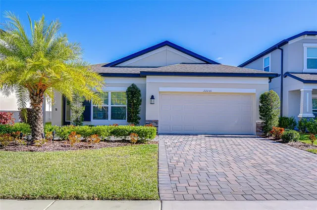 a view of a house with a backyard