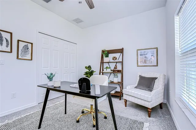 a workspace with furniture and a window