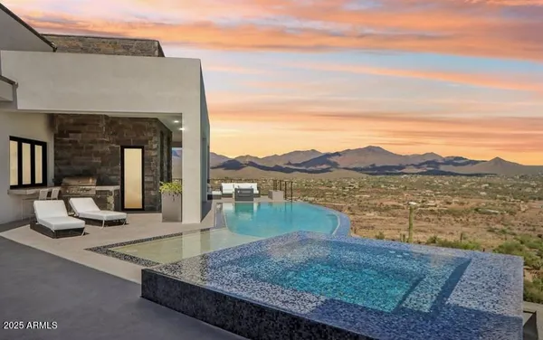 a view of a house with a mountain in the background