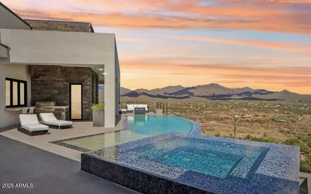 a view of a house with a mountain in the background