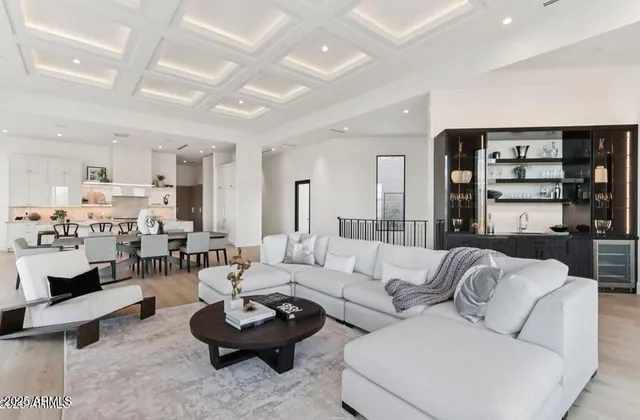 a kitchen with a stove a refrigerator and chairs