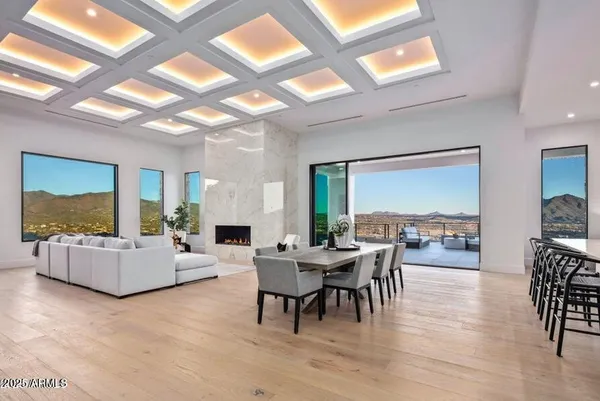a kitchen with granite countertop white cabinets and stainless steel appliances