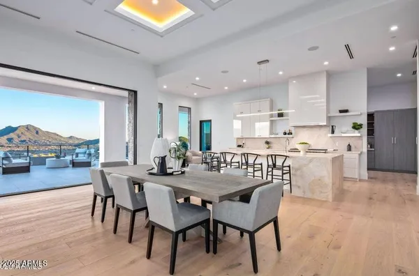 a large kitchen with stainless steel appliances lots of counter space and a sink