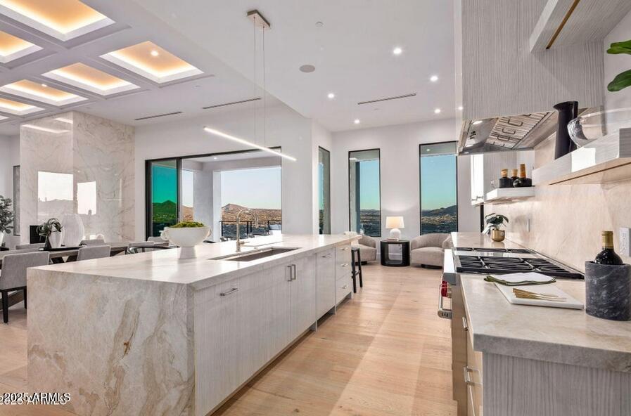 4880 East Lone Mountain Road North Cave Creek, AZ 85331 - Photo 19 of 73 a large kitchen with stainless steel appliances lots of counter space and a sink
