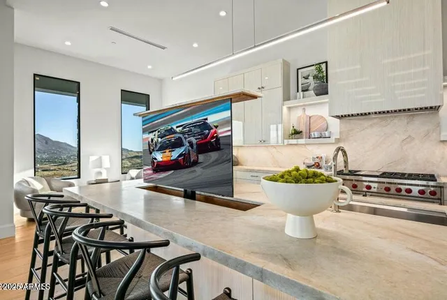 a kitchen with a sink stove and microwave