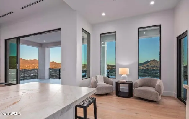 a kitchen with a sink and a large window