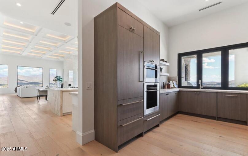 4880 East Lone Mountain Road North Cave Creek, AZ 85331 - Photo 22 of 73 a kitchen with a refrigerator and a sink