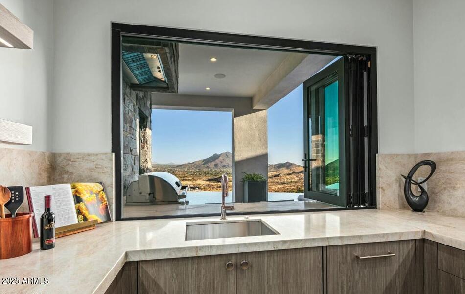 4880 East Lone Mountain Road North Cave Creek, AZ 85331 - Photo 25 of 73 a kitchen with a sink and a large window