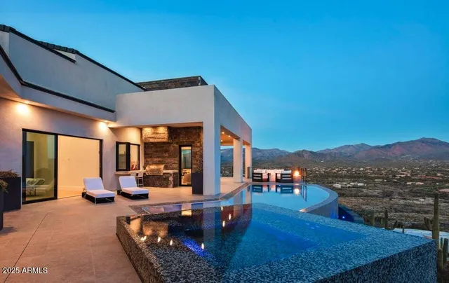 a view of a patio with couches chairs and a yard