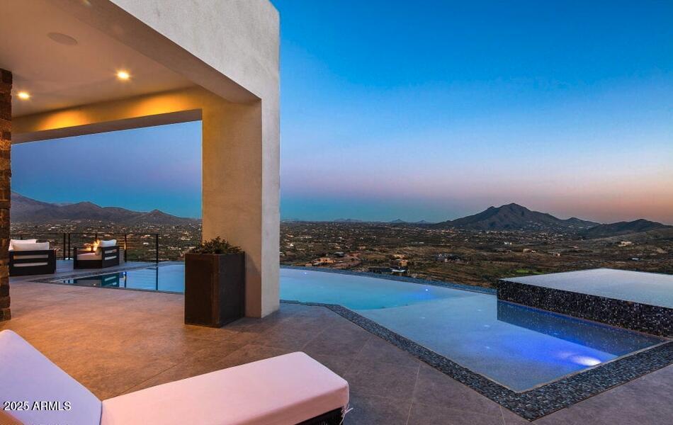 4880 East Lone Mountain Road North Cave Creek, AZ 85331 - Photo 28 of 73 a view of a terrace with a ocean