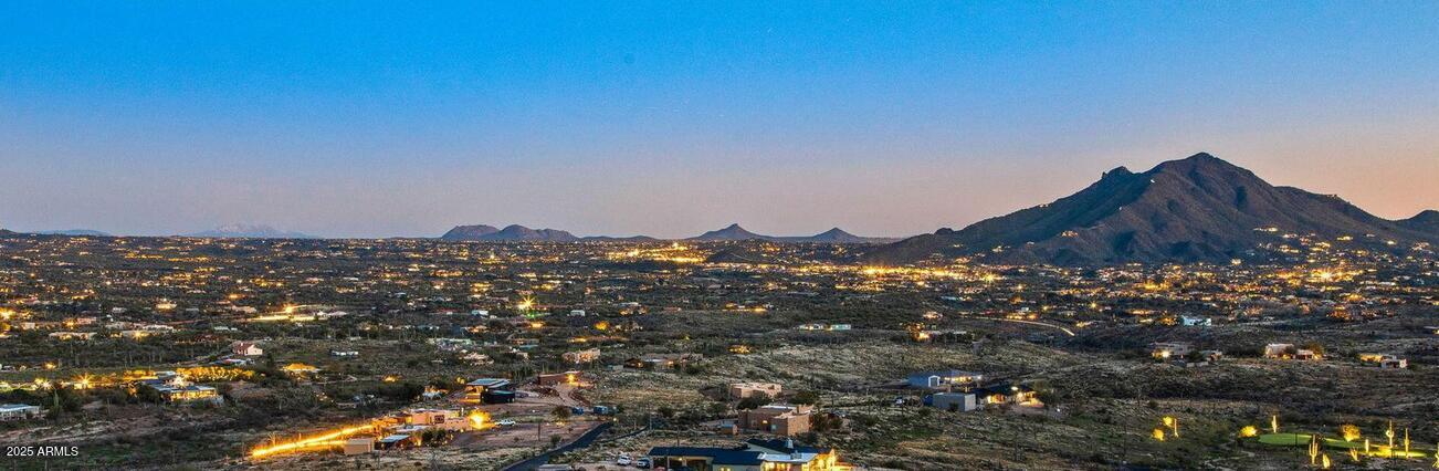 4880 East Lone Mountain Road North Cave Creek, AZ 85331 - Photo 3 of 73 a view of a house with a mountain in the background