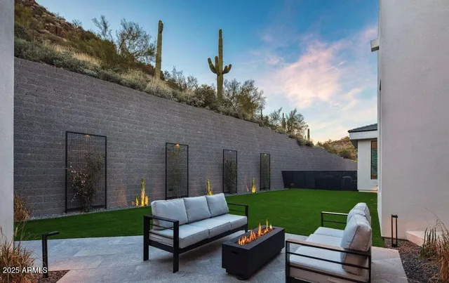 a view of a livingroom with furniture and a potted plant