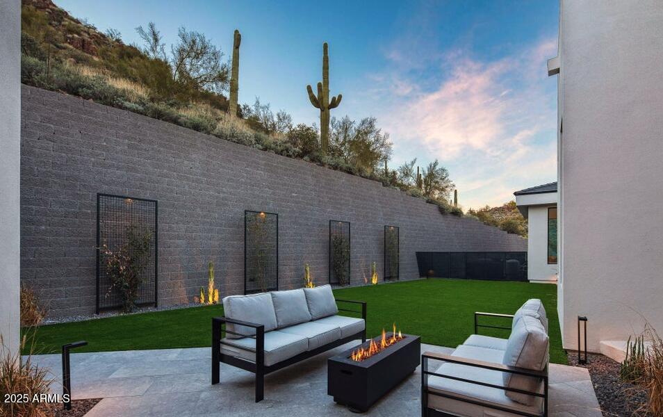 4880 East Lone Mountain Road North Cave Creek, AZ 85331 - Photo 33 of 73 a view of a patio with couches chairs and a yard