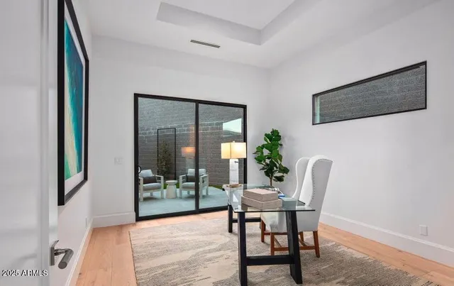 a view of hallway with bathroom