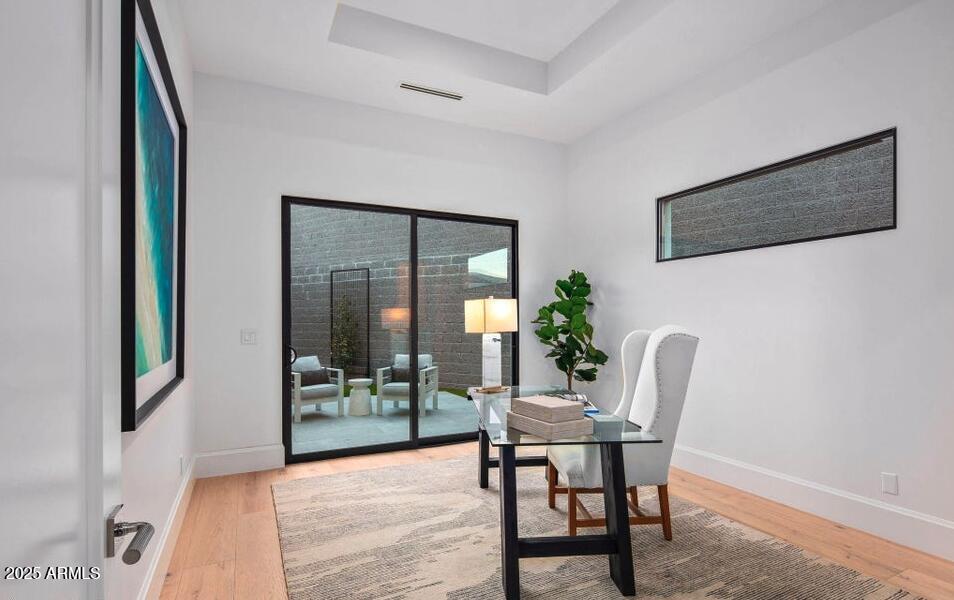 4880 East Lone Mountain Road North Cave Creek, AZ 85331 - Photo 35 of 73 a view of a dining room with furniture and wooden floor