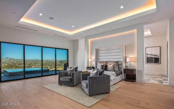 a living room with furniture a rug and white walls