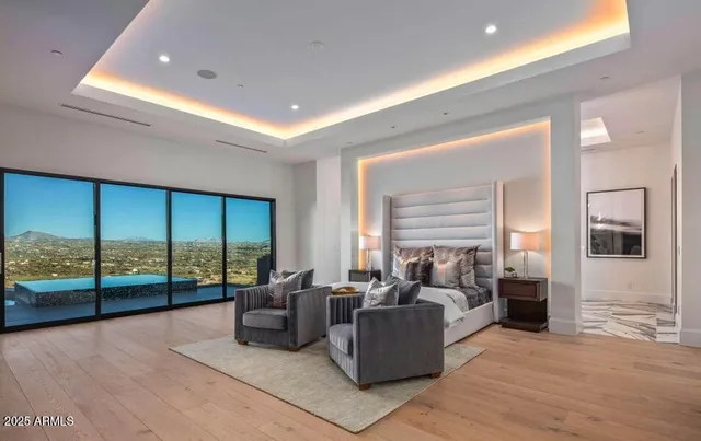 a living room with furniture a rug and white walls