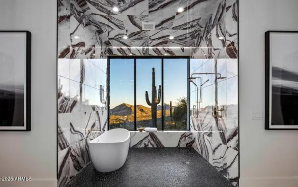 an empty room with wooden floor and balcony