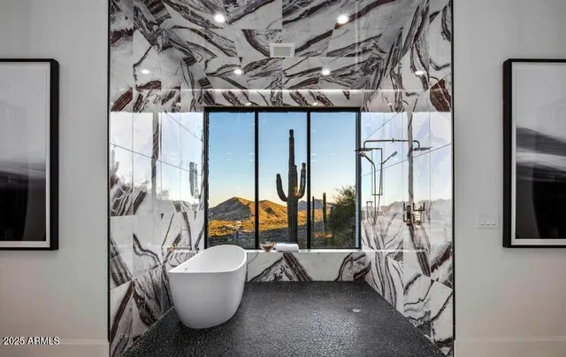 an empty room with wooden floor and balcony