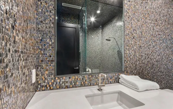 a living room with furniture and painting on the wall