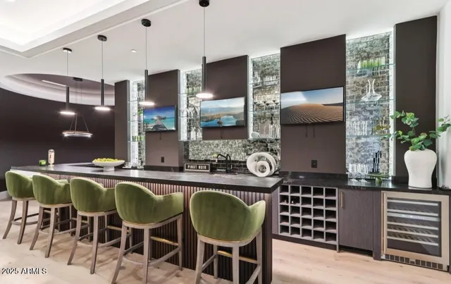 a front view of a house with mountain view and a garden