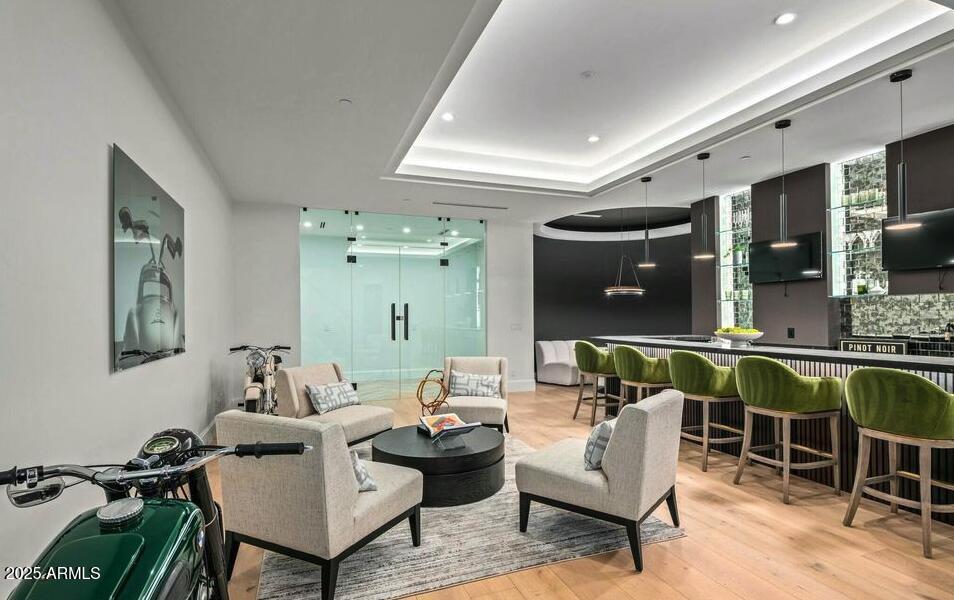 4880 East Lone Mountain Road North Cave Creek, AZ 85331 - Photo 52 of 73 a living room with furniture a rug and white walls