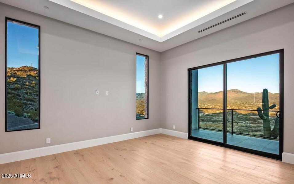 4880 East Lone Mountain Road North Cave Creek, AZ 85331 - Photo 60 of 73 a view of an empty room with wooden floor and a window