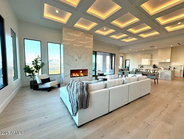 a living room with fireplace furniture and a flat screen tv
