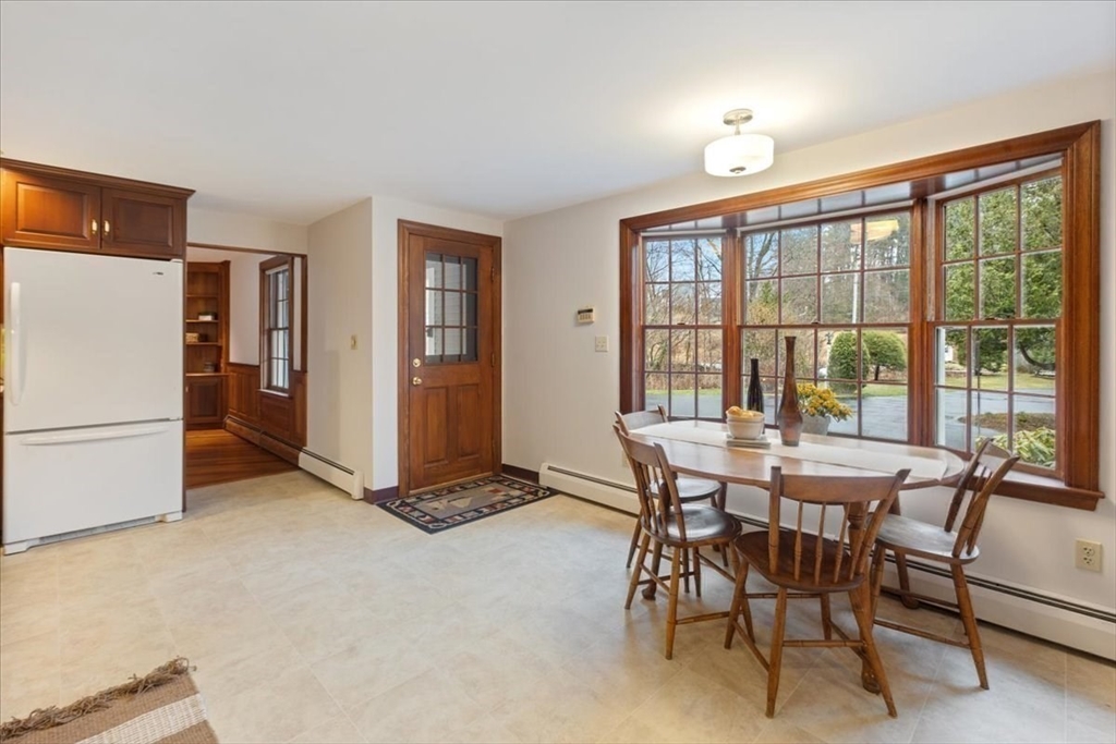 86 Dodges Row Wenham, MA 01984 - Photo 12 of 40 a view of a dining room with furniture window and outside view