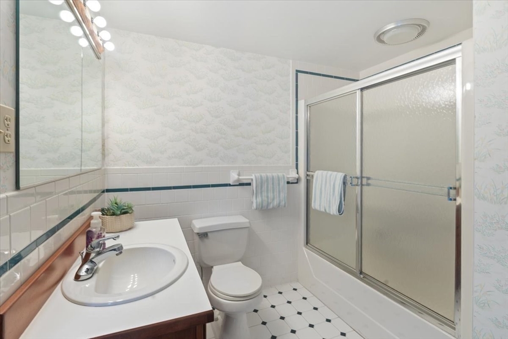 86 Dodges Row Wenham, MA 01984 - Photo 24 of 40 a bathroom with a sink toilet and shower