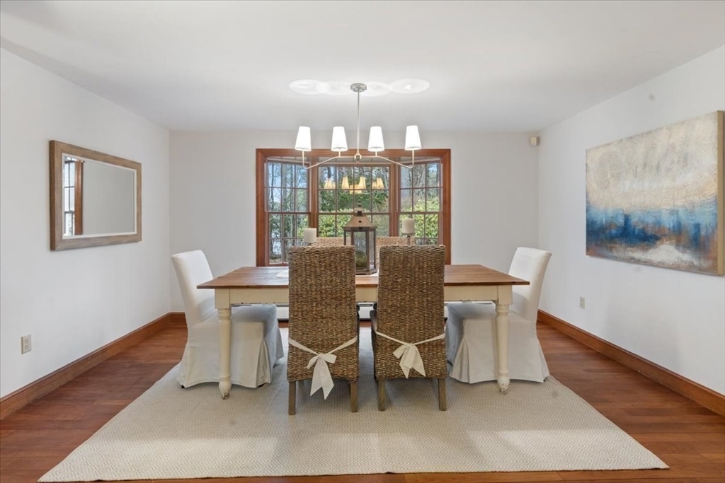 86 Dodges Row Wenham, MA 01984 - Photo 4 of 40 a view of a dining room with furniture and wooden floor