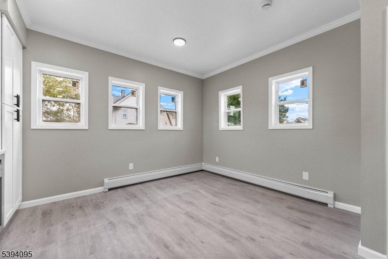 1033 East 23rd Street, Unit 2 Paterson, NJ 07513 - Photo 16 of 21 an empty room with windows