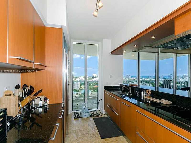 400 Alton Road, Unit 1011 Miami Beach, FL 33139 - Photo 6 of 13 a view of a room with gym equipment