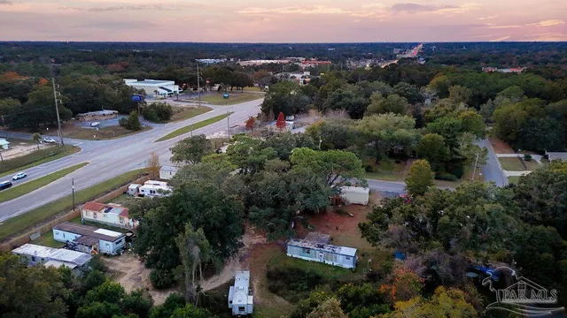 an aerial view of a house with outdoor space