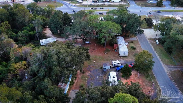 an aerial view of a house with outdoor space