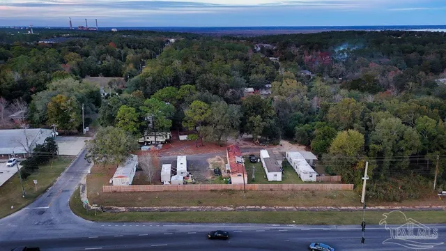 an aerial view of residential houses with outdoor space