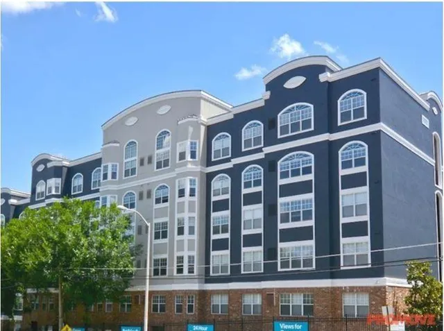 a front view of a building with a lot of windows