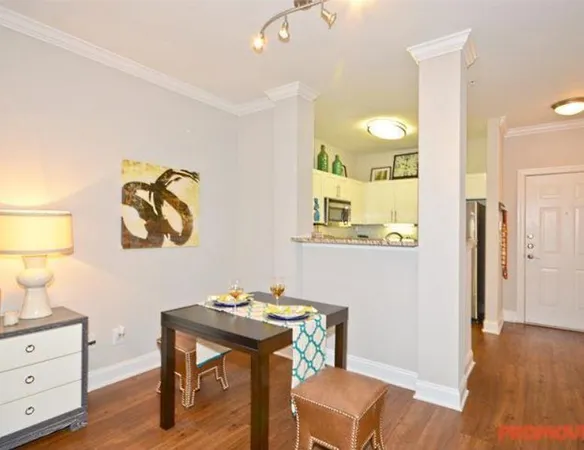 a bathroom with a sink mirror and vanity