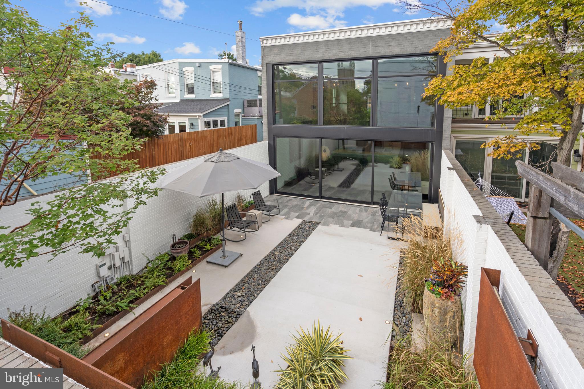 633 E Street Southeast Washington, DC 20003 - Photo 2 of 52 a view of a balcony with wooden floor and potted plants