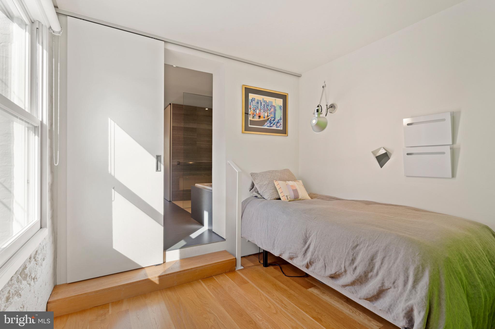 633 E Street Southeast Washington, DC 20003 - Photo 27 of 52 a bedroom with a bed and a window