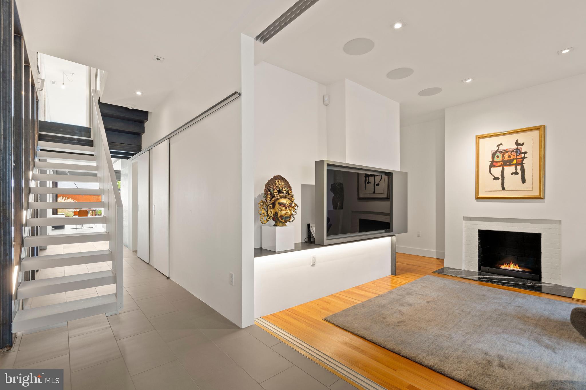 633 E Street Southeast Washington, DC 20003 - Photo 3 of 52 a living room with furniture and a fireplace