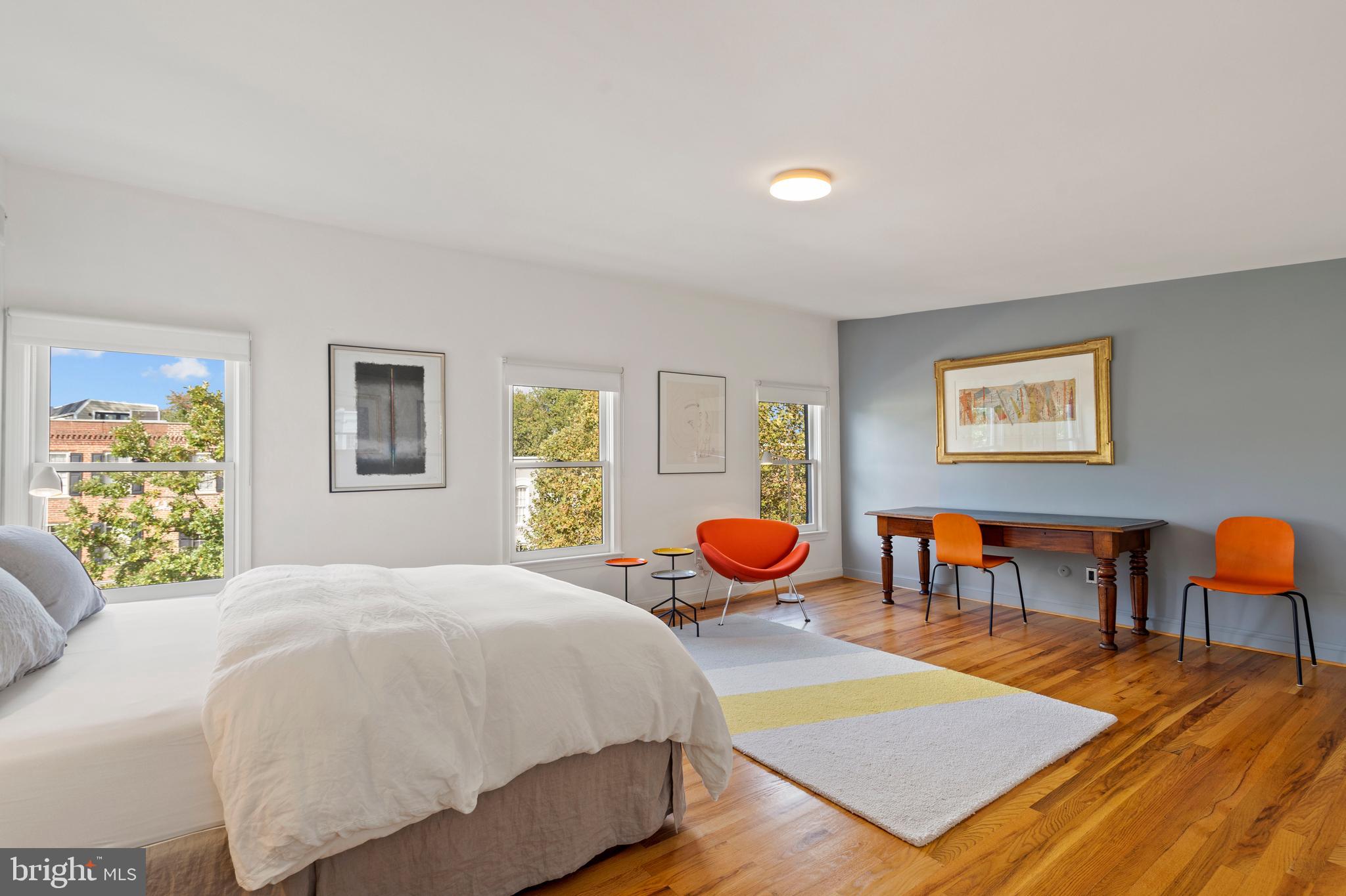 633 E Street Southeast Washington, DC 20003 - Photo 39 of 52 a bedroom with a bed and wooden floor