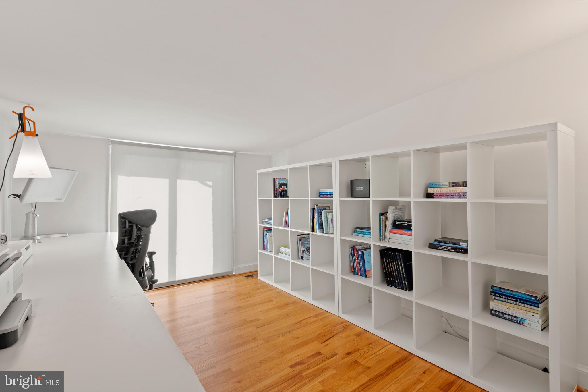 633 E Street Southeast Washington, DC 20003 - Photo 41 of 52 a room with a bed and a book shelf